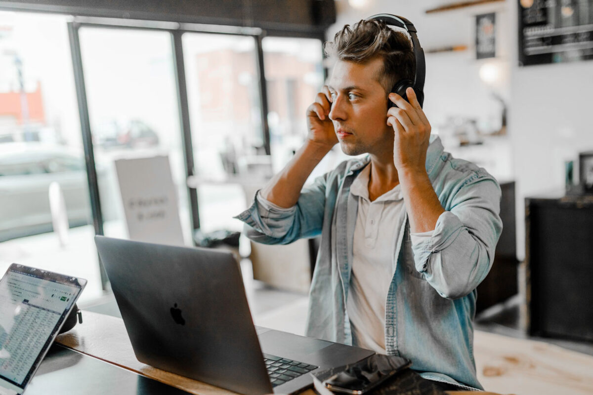 Headphones, laptop, man