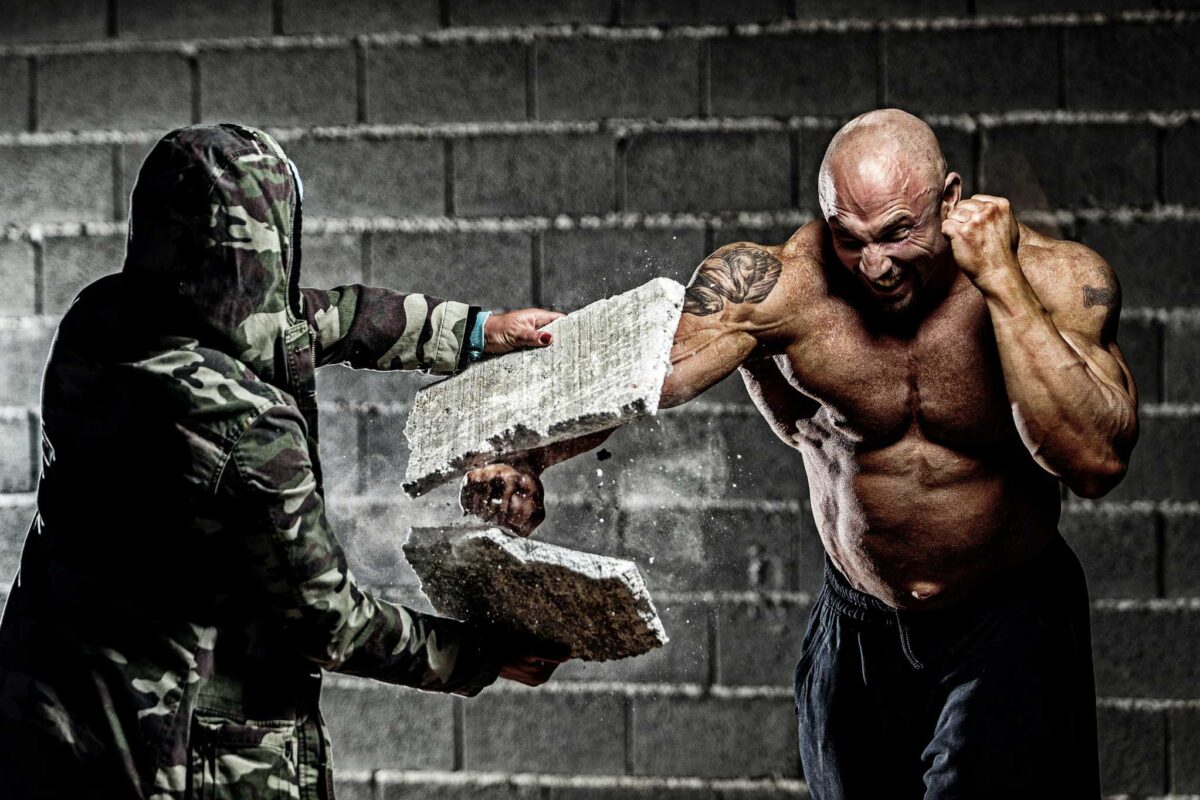 man punching block